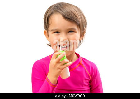 Little sick girl used medical spray for breath Stock Photo