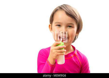 Little sick girl used medical spray for breath Stock Photo