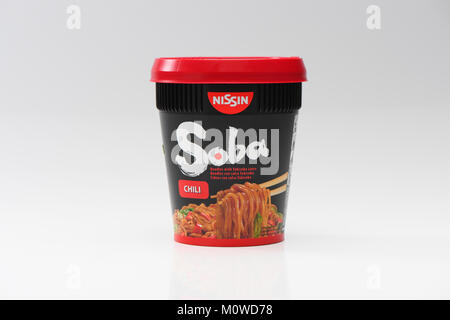 A single pot of Soba chilli noodles on a white background. Fast instant food pot just add boiled water. Stock Photo