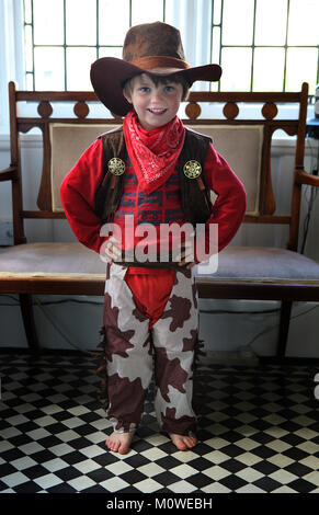 Young boy wearing a cowboy outfit Stock Photo
