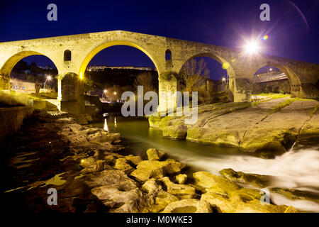 Stone bridge near Cave of Saint Ignatius with lights in evening in Manresa Stock Photo