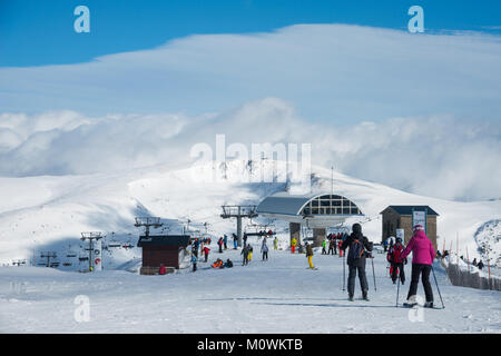 Skiers moving from between lifts above Soldeu and El tarter, Grandvalaria ski area, Andorra, Europe Stock Photo