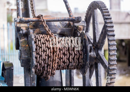 An old industrial winch on the River Thames, London Stock Photo