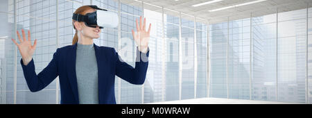 Composite image of young businesswoman gesturing while wearing vr glasses Stock Photo