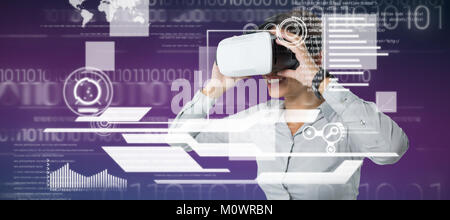 Composite image of female executive using virtual reality headset Stock Photo
