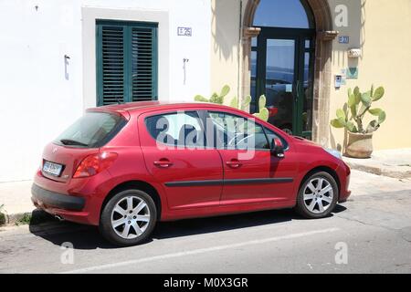 GALLIPOLI, ITALY - MAY 31, 2017: Peugeot 207 small hatchback car parked in Italy. There are 41 million motor vehicles registered in Italy. Stock Photo