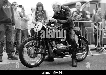 85 year old Motorcycle racing legend Sammy Miller starting his Bike Stock Photo
