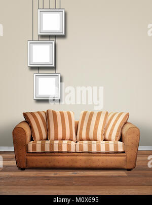 Modern interior with sofa and three hanging alu frame. Souvenir in frame at the wall Stock Photo