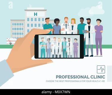 Professional medical staff and doctor posing together at the hospital, a man is taking a picture using a smartphone Stock Vector