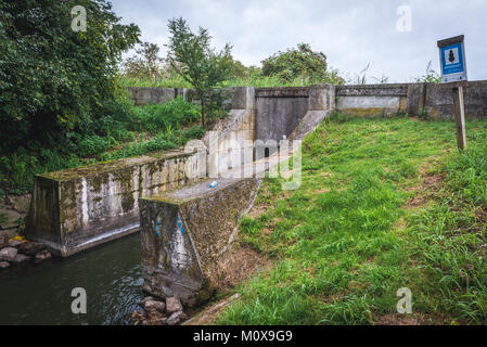 A unique crossing of two small water canals built on the turn of 19th and 20th centuries in Silice village, Warmian-Masurian Voivodeship of Poland Stock Photo