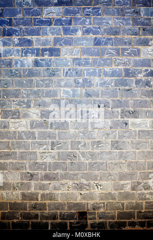 Old stained stone brick wall background or texture. Stock Photo