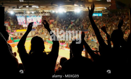 crowd cheering at basketball stadium Stock Photo