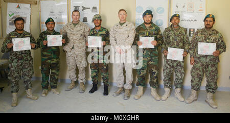 Soldiers of the Afghan National Army 215th Corps show off their graduation certificates from the Tactical Site Exploitation Course while standing alongside Marines who helped evaluate and refine the soldiers skills of at Camp Shorabak, Afghanistan, Jan. 18, 2018. The course teaches follow-on skills and progressive training of explosive ordnance disposal lead by Task Force Southwest. The graduates are now certified to train other soldiers in the same course, thus helping to self-sustain the 215th Corps. (U.S. Marine Corps Stock Photo