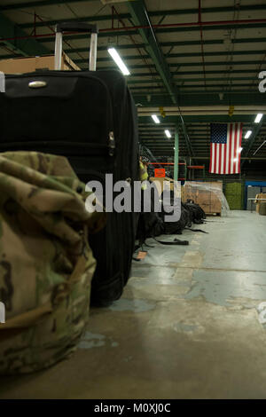 Luggage belonging to 12 returning 436th Security Forces Squadron defenders rests in a warehouse after a six-month deployment to the Middle East, Jan. 21, 2018, at Dover Air Force Base, Del. Families and unit members met the defenders upon their return. (U.S. Air Force Stock Photo