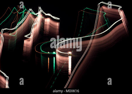 Abstract defocused light curves lines on the black night background, long exposure Stock Photo
