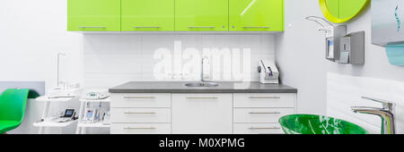 Panoramic view of dentistry clinic modern interior with lime cabinets Stock Photo