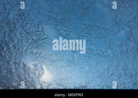 Hail and ice graupel, on glass of rooftop window after hailstorm, Netherlands. Stock Photo