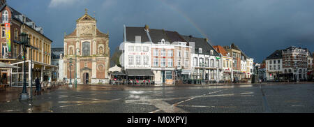 Sittard markt,Netherlands, dark clouds over square, centre of town with saint michaels church, Limburg province, Holland, Netherlands. Stock Photo