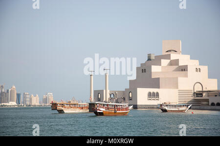 Doha, Qatar, November 25th 2016: Traditional dhows in front of Museum of Islamic Art Stock Photo