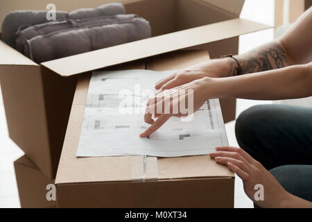 Planning new house design concept, hands pointing on plan closeu Stock Photo