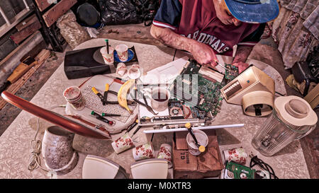 A bachelor man working on his computer. Stock Photo