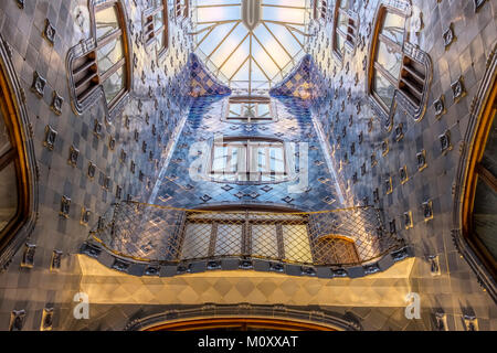 The atrium covered in blue tiles of the Casa Batllo is Barcelona Stock Photo