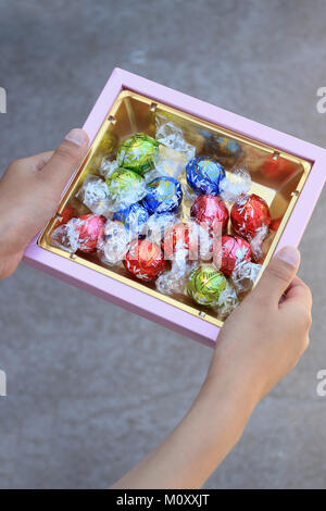 Close up of Assorted Lindt Lindor Chocolates in gold colour box Stock Photo