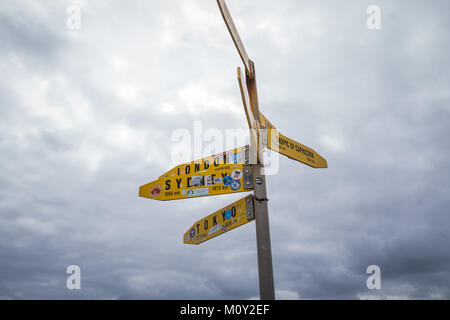 Cape Reinga signpost, New Zealand Stock Photo