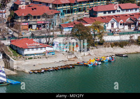 View of the shoreline of Nainital Lake with pleasure boats, Nainital, Uttarakhand, northern India, Ayerpatta in the Himalayan Kumaon foothills Stock Photo