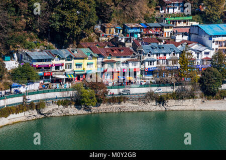 View of Mall Road, the main street of Nainital with local shops and shoreline of Nainital Lake, Ayerpatta, Uttarakhand, north India, hill station town Stock Photo