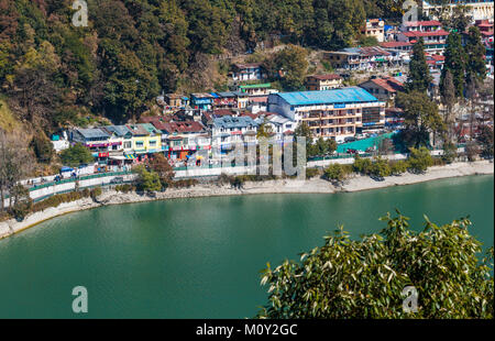 View of Mall Road, the main street of Nainital with local shops and shoreline of Nainital Lake, Ayerpatta, Uttarakhand, north India, hill station town Stock Photo