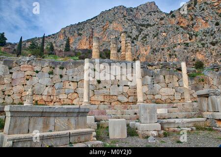 Apollo Temple in Delphi, an archaeological site in Greece, at the Mount Parnassus. Delphi is famous by the oracle at the sanctuary dedicated to Apollo Stock Photo