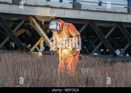A metal fabricator welding the iron stanchions during renovation work on Southport Pier in Merseyside, UK. Stock Photo