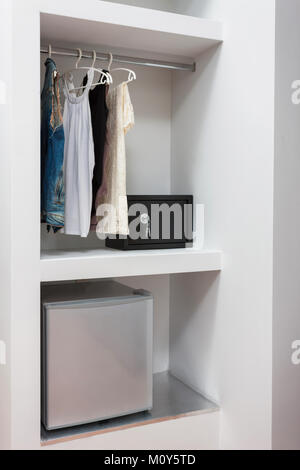 wardrobe safe lock and mini bar of a room in a hotel Stock Photo