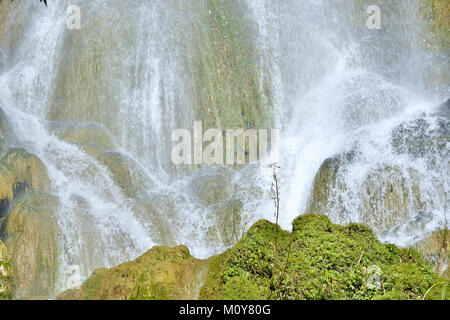 Waterfall in a lush rainforest. Beautiful waterfalls or cascades in El Nicho, El Nicho waterfall, in Scambray mountains. Cienfuegos province, Cuba. Stock Photo