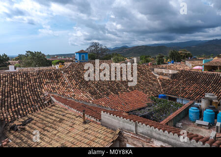 Lookout over Trinidad, Cuba with moody clouds, blue and teracotta buildings Stock Photo