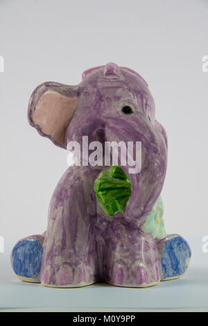 Homemade ceramic elephant on a white background Stock Photo