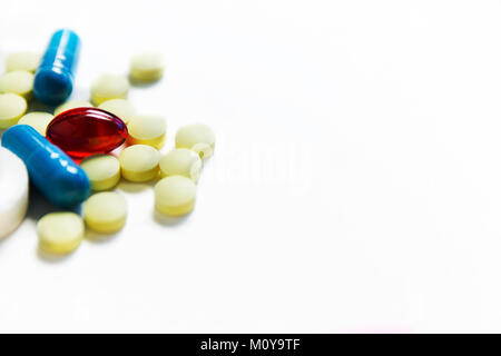 yellow, blue, red pills, medicine isolated on white background Stock Photo