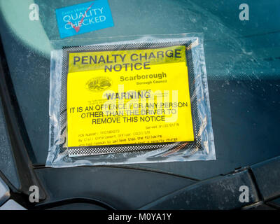 Penalty Charge Notice on a car that has failed to display a valid  paid parking ticket issued by  Scarborough Borough Council Civil Enforcement Office Stock Photo