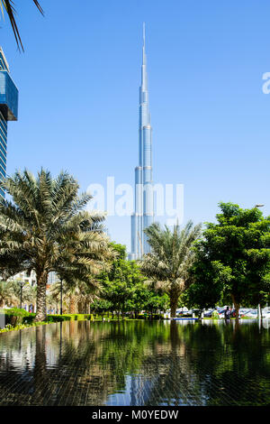 DUBAI, UNITED ARAB EMIRATES - OCTOBER 21, 2017: Burj Khalifa mega tall skyscraper in Dubai day view from the park with clear blue sky Stock Photo