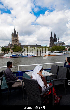 Germany, Cologne, view from a ship to the Romanesque church Gross St. Martin and to the cathedral.  Deutschland, Koeln, Blick von einem Schiff zur Kir Stock Photo