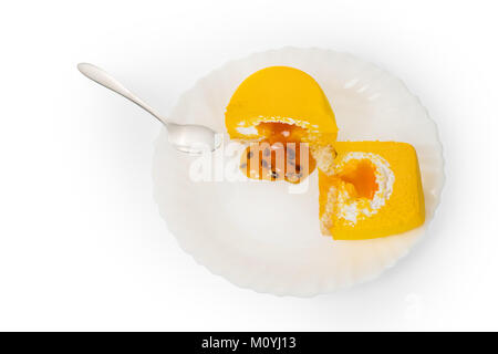Yellow cake piece with jelly on white plate. Isolated on white, clipping path included Stock Photo