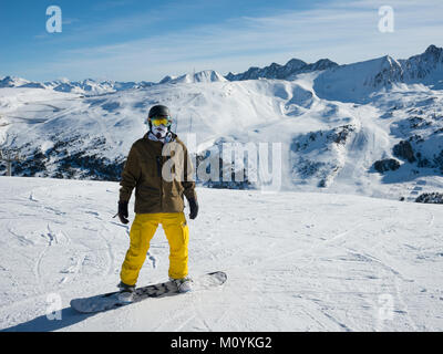 A portrait of a snowboarder at the top of a run, Grandvalaria ski area, Andorra, Europe Stock Photo