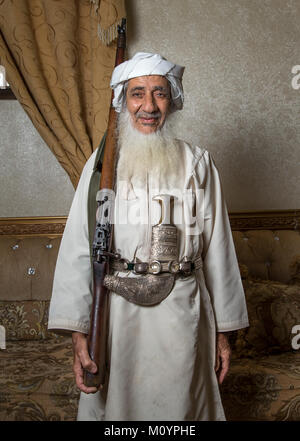 Nizwa, Oman, 26th May, 2016: omani man in traditional outfit with a hunting rifle Stock Photo