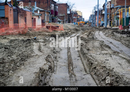 Roadworks on muddy street Stock Photo