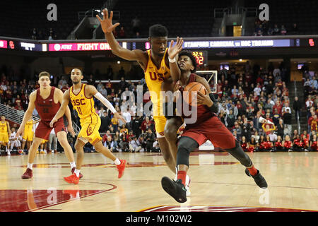 January 26, 2018: Stanford Cardinal guard Daejon Davis (1) gets a face full of the arm of USC Trojans forward Chimezie Metu (4) in the second half in the game between the Stanford Cardinal and the USC Trojans, The Galen Center in Los Angeles, CA