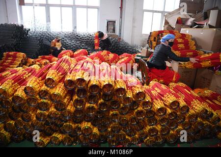Hefei, China's Anhui Province. 24th Jan, 2018. Workers make lanterns at a factory in Luyang District of Hefei City, east China's Anhui Province, Jan. 24, 2018. People here work hard to make red lanterns for Chinese Lunar New Year. Credit: Liu Junxi/Xinhua/Alamy Live News Stock Photo