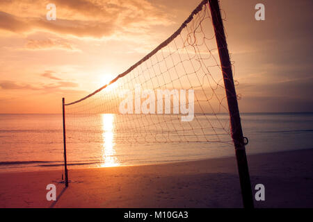 Valleyball net on the beach with beautiful seasacpe view and sunset light in twilight time at Chao Lao Beach, Chanthaburi Province, Thailand. Stock Photo