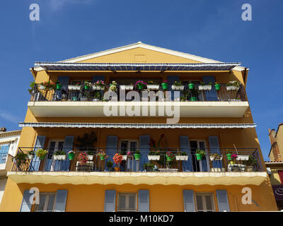 display of potted plants on balconies of a building in Le Lavandou Stock Photo