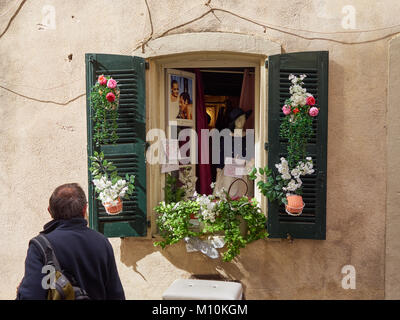 A shop window in St Tropez, France. Could be the smallest shop window in St Tropez? Stock Photo